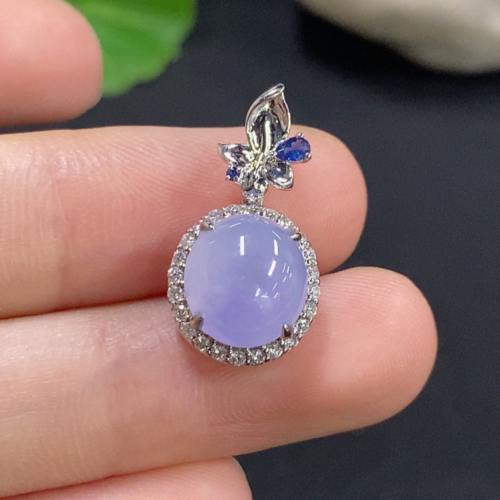 Jadeite cabochon pendant with 18k gold and diamond accents, featuring a smooth green jade stone and intricate gold detailing.