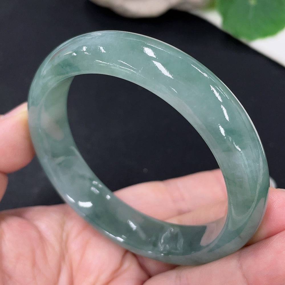 Huiliu certified jadeite round bracelet featuring smooth, polished green jade beads on a string, showcasing elegant craftsmanship.