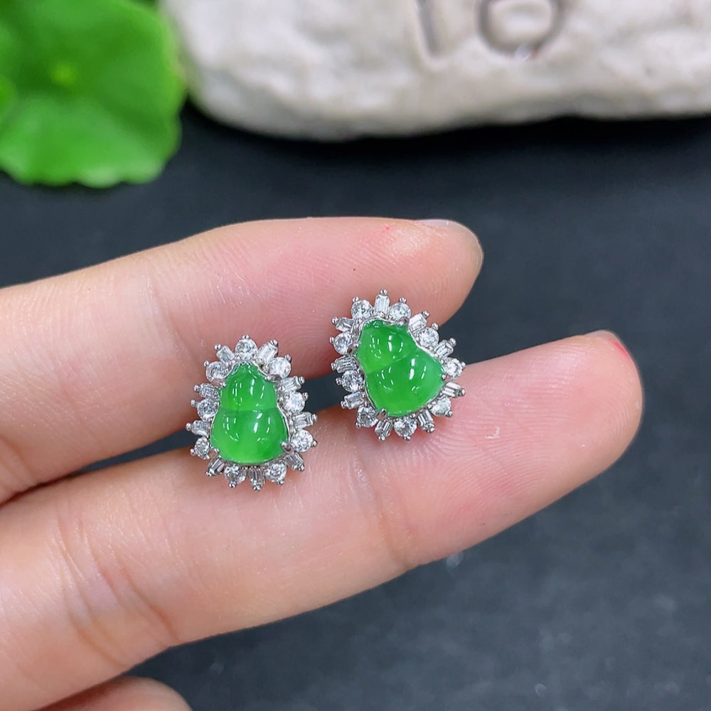 HKHQ jadeite earrings featuring smooth green jade stones, crafted in a simple, elegant non-gold, non-diamond design.