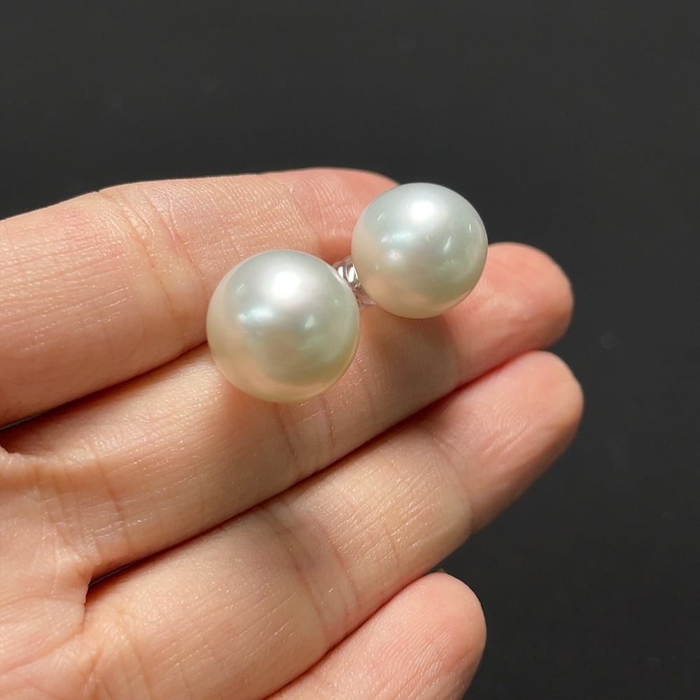 Saltwater pearl earrings with 18K gold hooks from HKHQ, featuring lustrous pearls and elegant design.