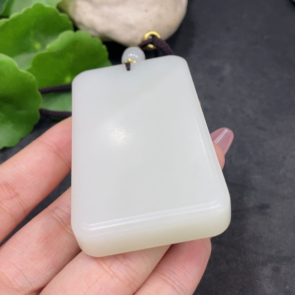 Huiliu certified Hetian jade plain pendant showcasing smooth, polished jade surface in natural green hues.