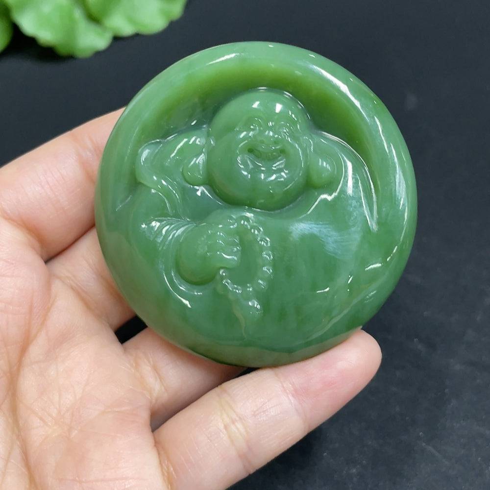 Huiliu certified Hetian Jade Jasper pendant featuring a Buddha design, showcasing smooth green and brown tones with intricate carvings.