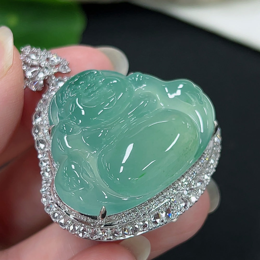 Jadeite Buddha pendant with diamond accents, 18K gold setting, detailed carved Buddha figure, weighs approximately 20g.