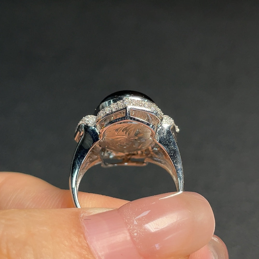 Huiliu sapphire ring with diamond accents, showcasing a vibrant blue gemstone and sparkling diamonds on a silver band.