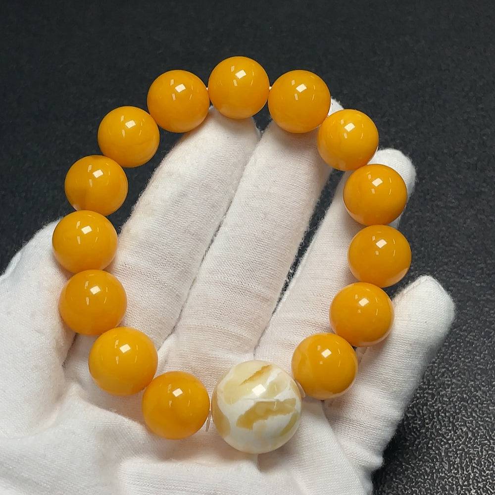 Huiliu Amber Beeswax Bracelet with 18.4mm amber beads, natural yellow color, and Huiliu certification, showcasing the handcrafted jewelry.