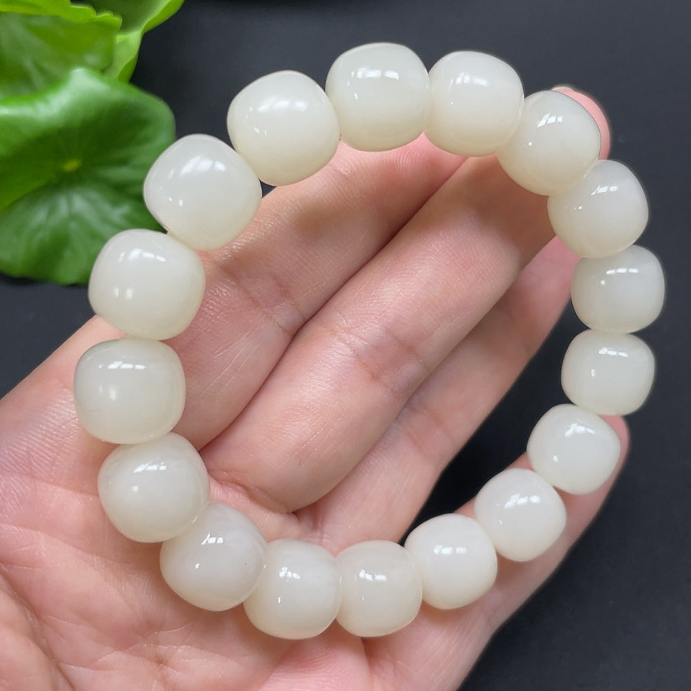 Hetian Jade bracelet with 12mm beads, approximately 49.78g, crafted by HKHQ featuring smooth, polished jade stones.