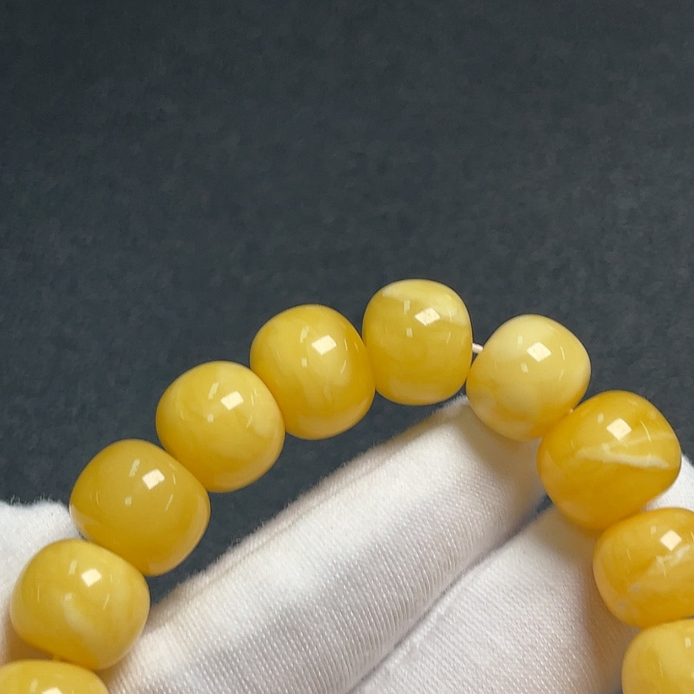 Huiliu amber beeswax bracelet with 12.7mm Southern Red Agate bead, natural amber color, handcrafted jewelry piece
