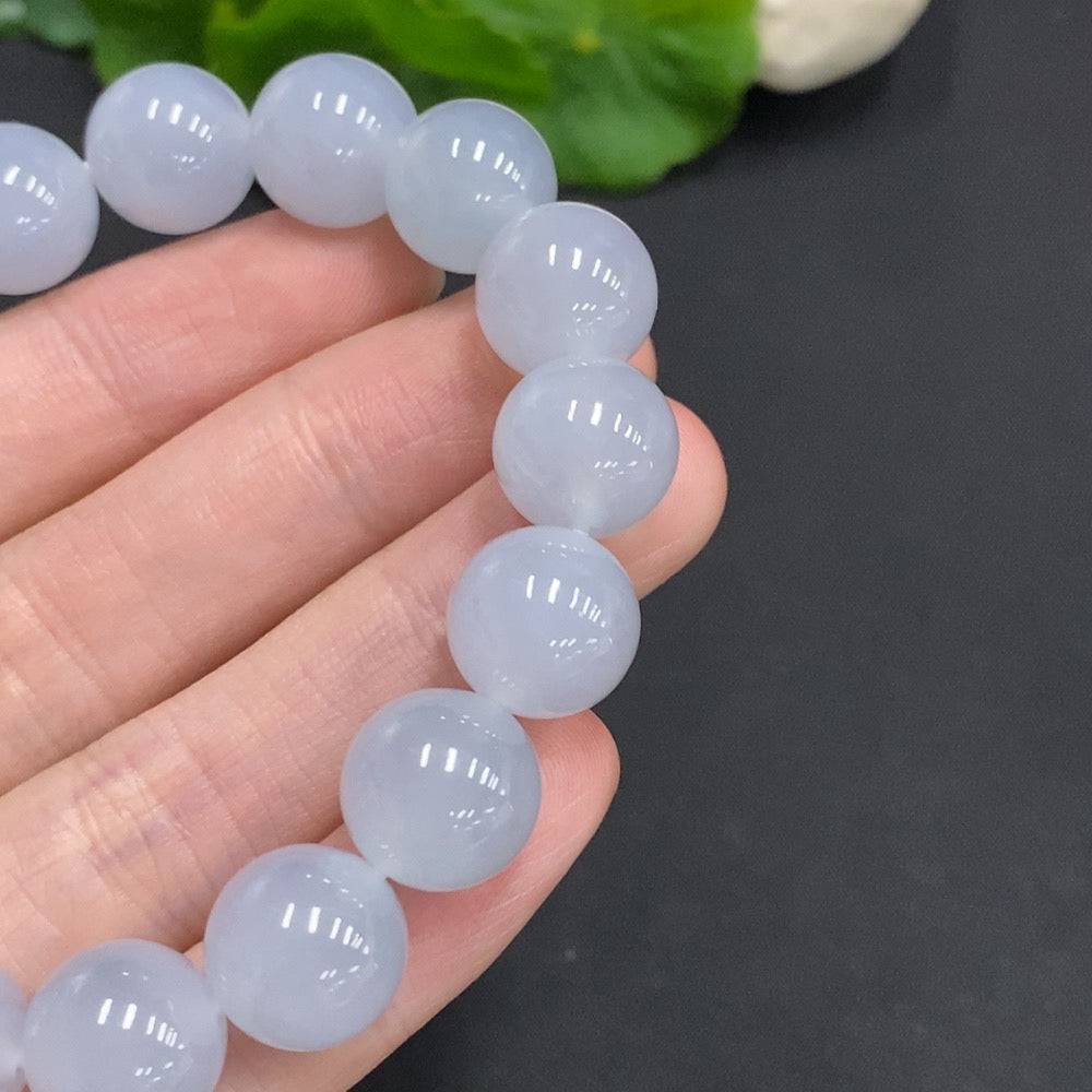HUILIU HQ jadeite bracelet, 12mm wide, weighing approximately 50.3 grams, featuring smooth green jade beads.