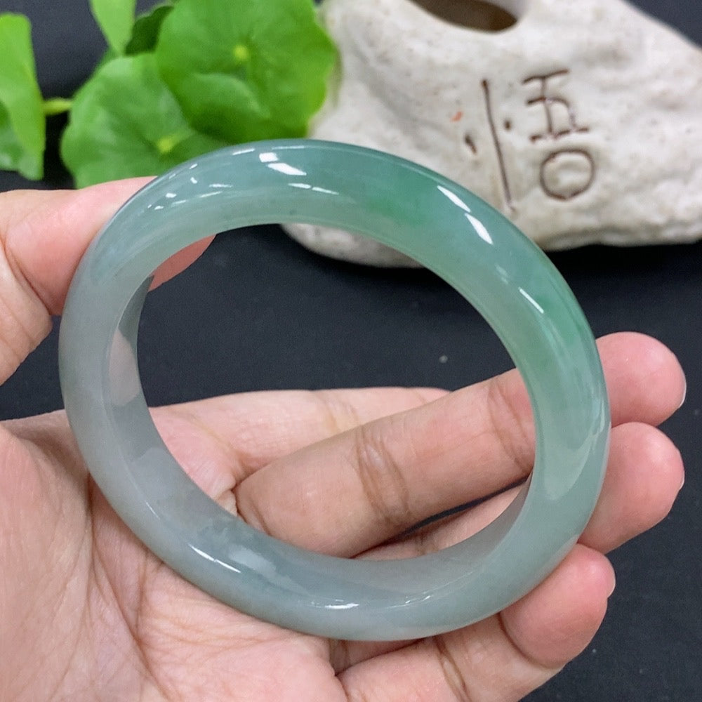 HKHQ jadeite round bangle in size 55.5, weighing 53.26g, showcasing smooth, polished jadeite with a vibrant green hue