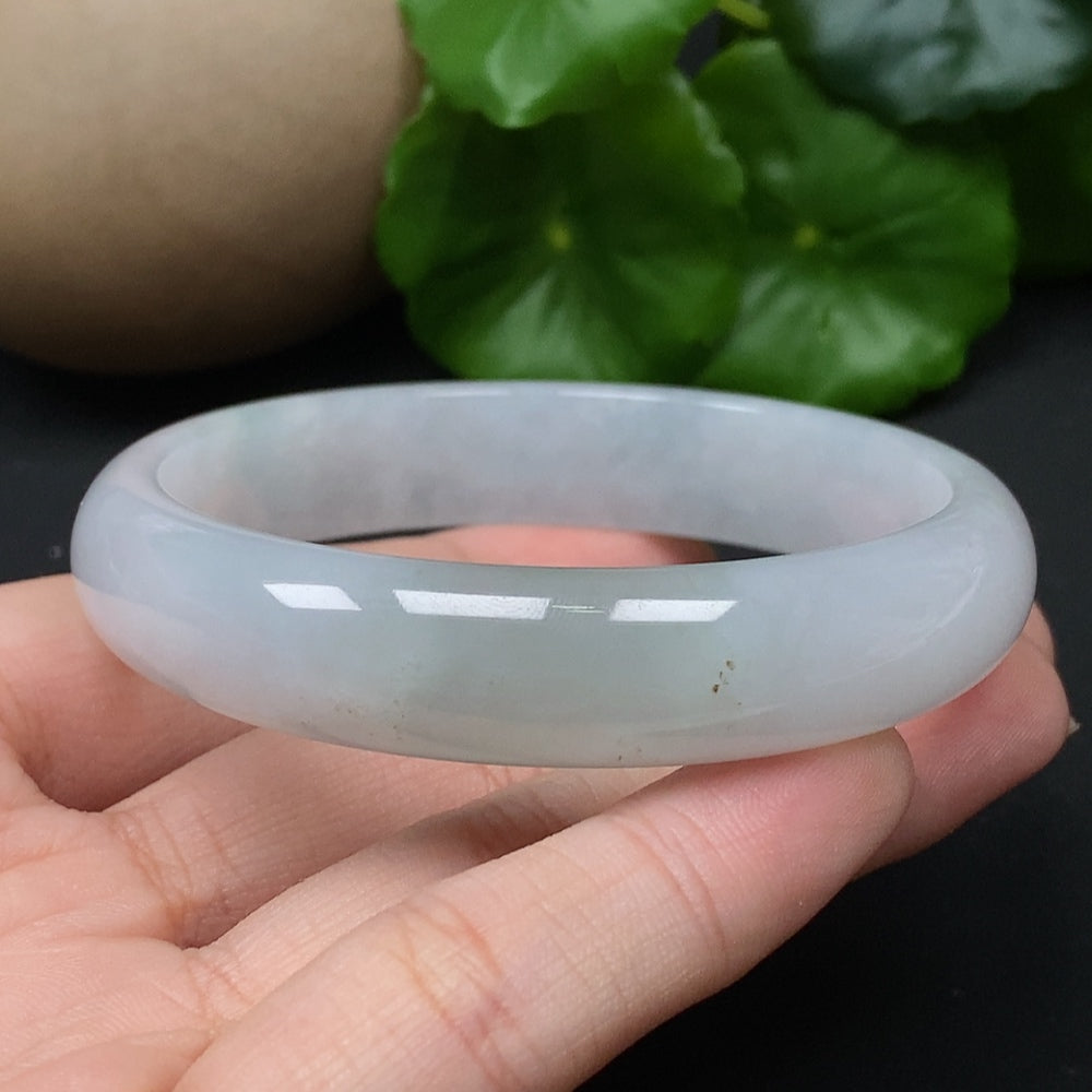 Jadeite round bangle in size 56.5, weighing approximately 43.17g, showcasing smooth green jade with polished finish.