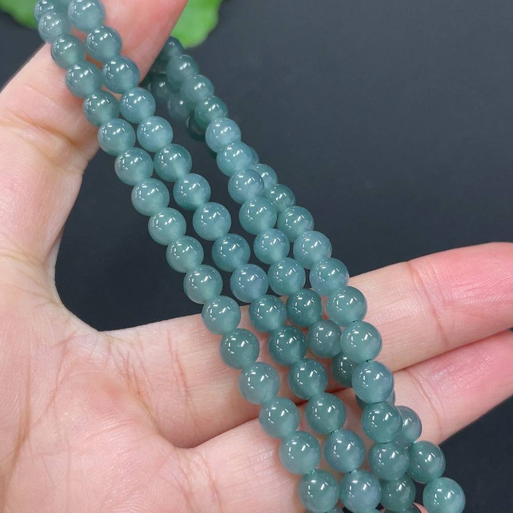 Huiliu certified Hetian jade pendant featuring Manjushri Bodhisattva with intricate carving and polished finish.