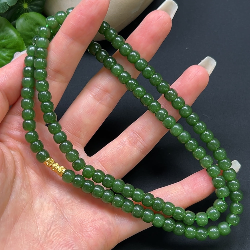 Hetian Jade bead necklace by HKHQ featuring 6.2mm smooth, non-gold jade beads on a stylish necklace.
