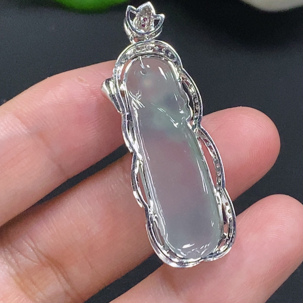 Jadeite pendant with 18K gold setting, accented with diamonds, weighing about 7.5g, featuring vibrant green jade and sparkling stones.