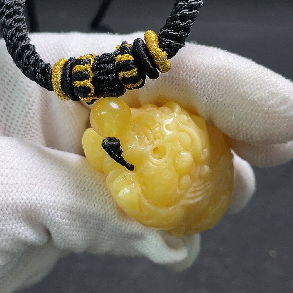 Huiliu Amber beeswax pendant with rope, natural amber jewelry, handcrafted pendant featuring warm amber tones and a sturdy rope cord.