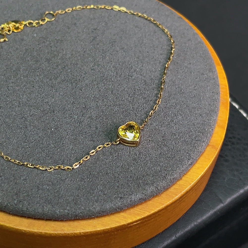 HKHQ sapphire inlaid bracelet with 18k gold, showcasing vibrant blue gemstones and delicate craftsmanship.