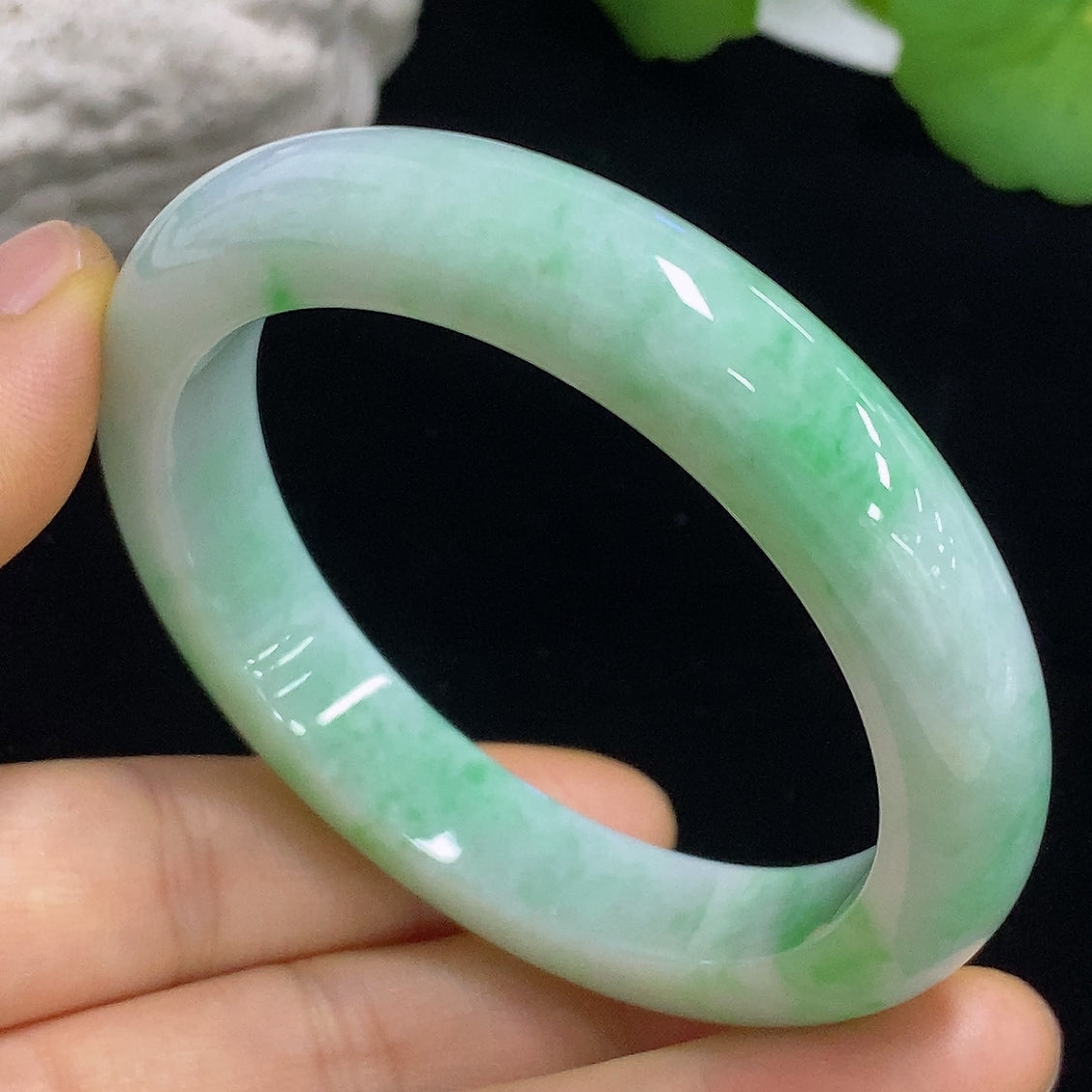 HKHQ jadeite round bangle with 57.1g weight and size 55.4, showcasing smooth, polished green jade jewelry design.