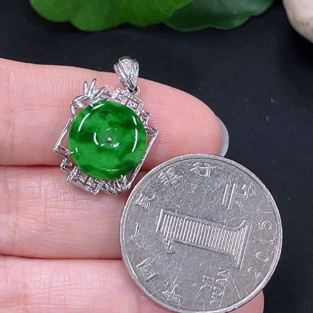 Jadeite inlaid pendant with 18K gold setting, crafted by HUILIU HQ, showcasing a smooth, polished jade stone with gold accents.