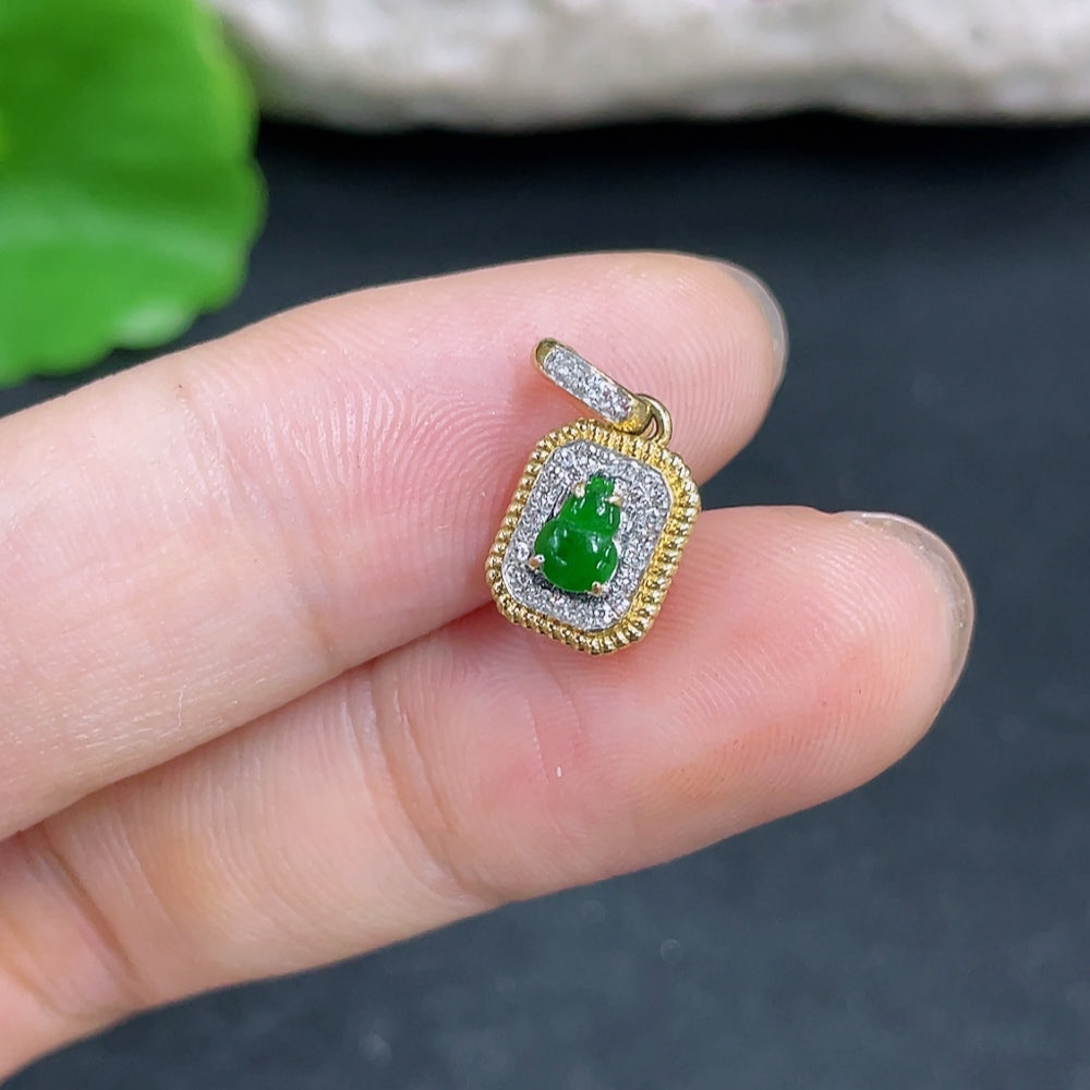 Jadeite gourd pendant with 18k gold and diamond accents, featuring intricate inlay work, displayed against a neutral background.