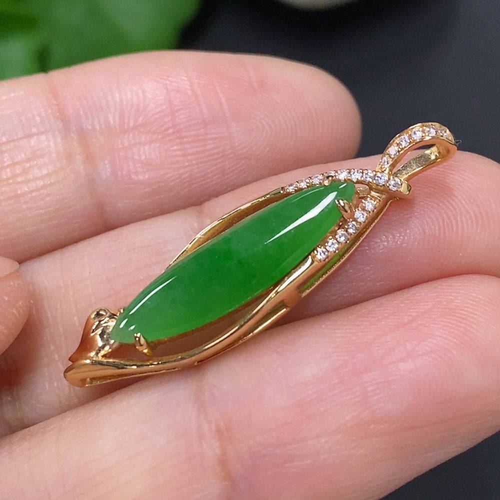 Jadeite pendant with diamond accents mounted in 18K gold, weighs approximately 2.5g, featuring a polished jade stone.