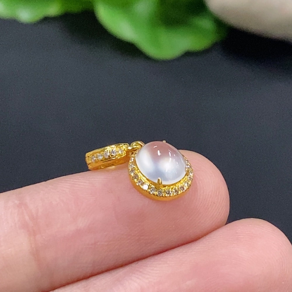 Jadeite cabochon pendant with 18K gold and diamond accents, HKHQ necklace featuring a polished green gemstone.