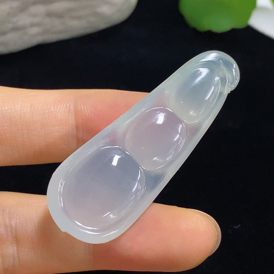 Jadeite pendant with Fu Dou design, approximately 9.8g, from HKHQ, showcasing smooth green jade with intricate carved details.