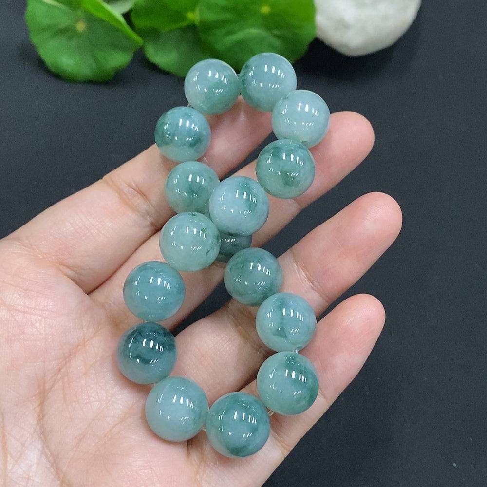 Huiliu Jadeite bead necklace with 12.4mm jade beads, featuring a natural green hue and polished finish.
