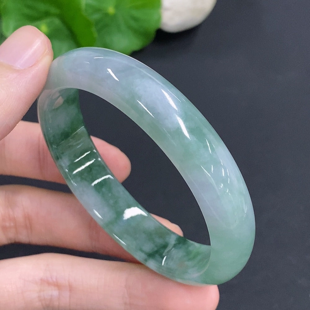HKHQ jadeite oval bangle in size 53, weighing 38.1g, featuring smooth, polished jadeite bracelet with a classic oval shape.