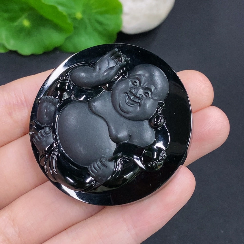 Jadeite Buddha pendant from HKHQ, featuring intricate carving and a smooth jade surface, weighing approximately 44.6 grams.