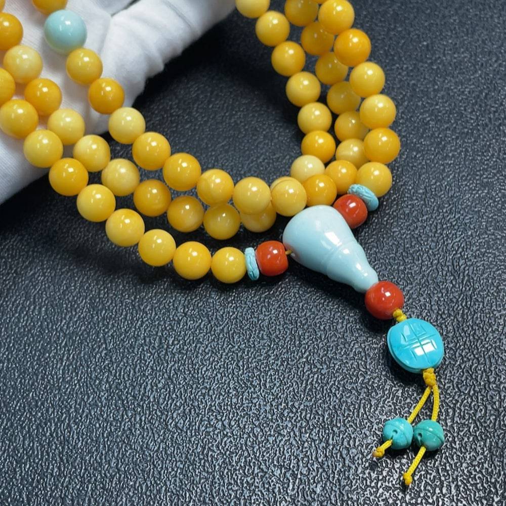 Huiliu amber and beeswax bead strand with turquoise accents, 8.6-16.1mm, natural-looking stones, certified by HUILIU HQ