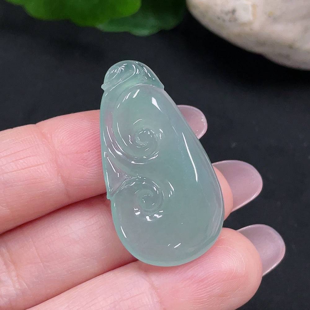Jadeite Ruyi pendant from HUILIU HQ showing smooth, polished jade surface with intricate Ruyi design, weighs approximately 5.98g.
