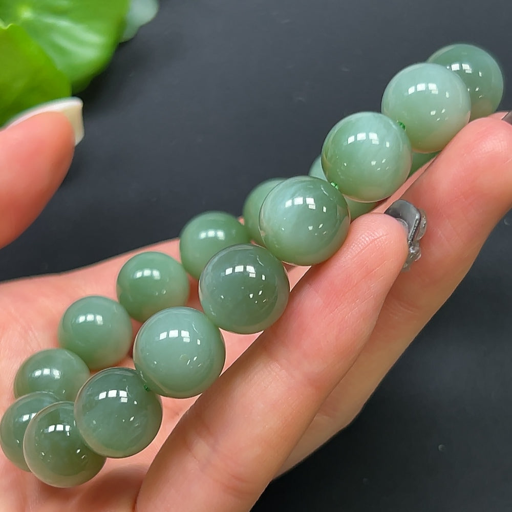 HKHQ Hetian Jade bracelet with 11.8mm beads, showcasing smooth, polished green jade stones and a sturdy clasp.