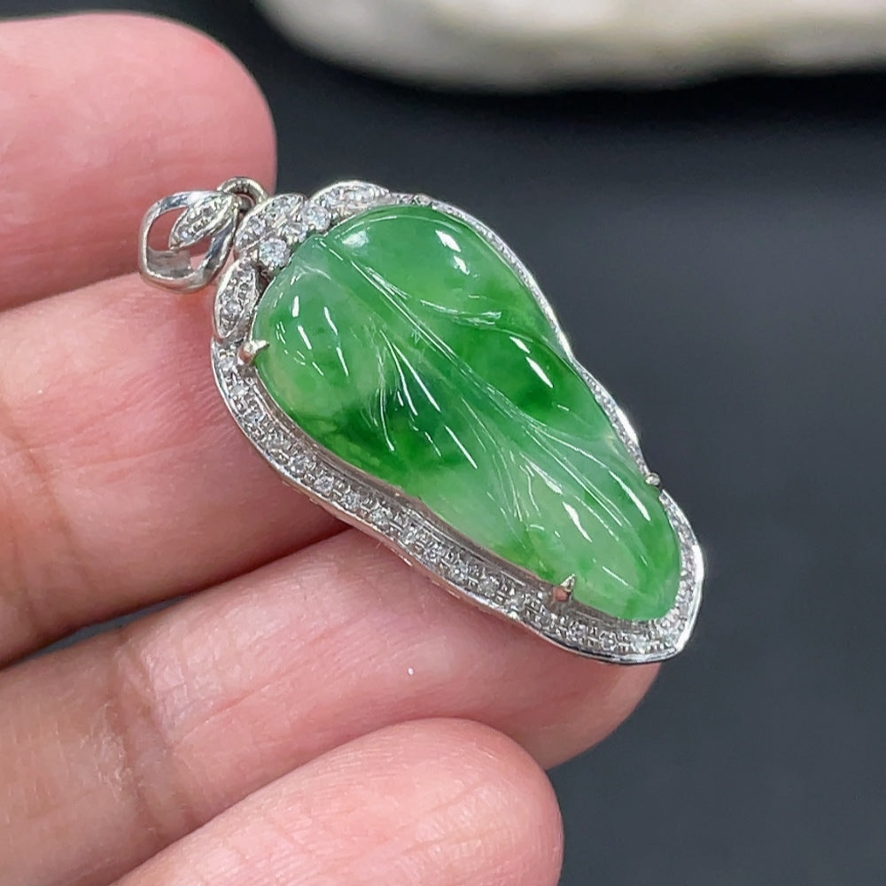 Jadeite leaf inlay pendant with 18k gold and diamond accents, weighing approximately 3g, crafted by HKHQ.