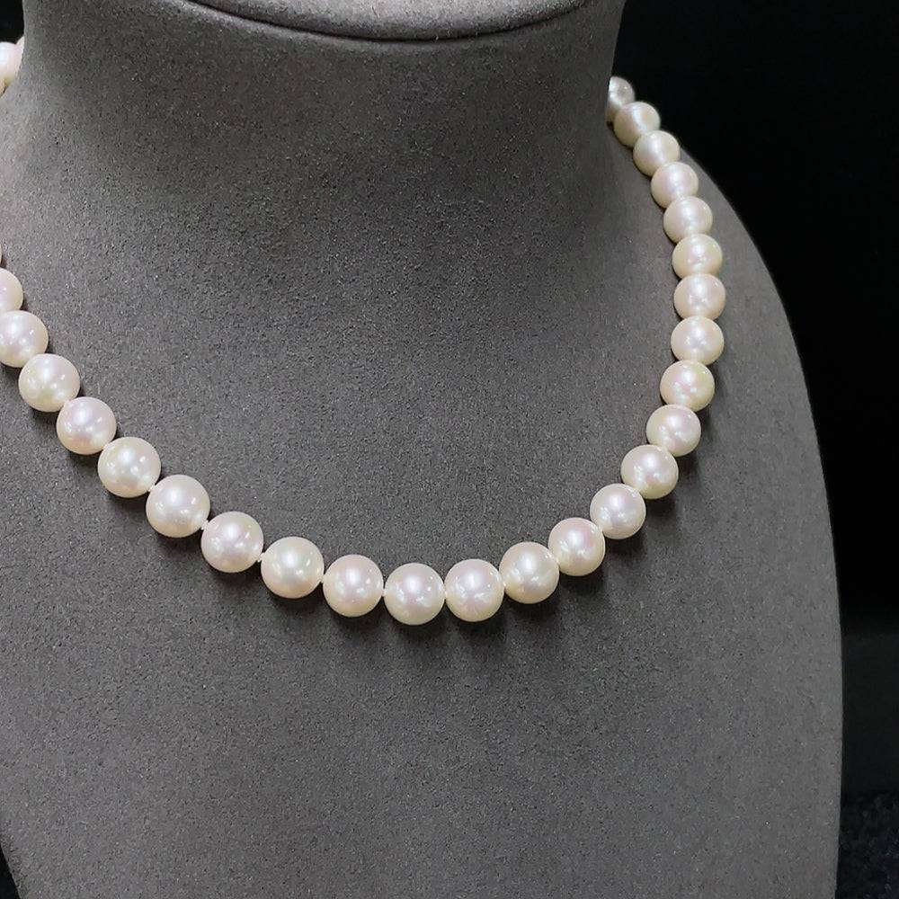 HUILIU HQ pearl necklace featuring suspected plated pearls with a 6mm strand, certified by Huiliu, displayed against a neutral background.