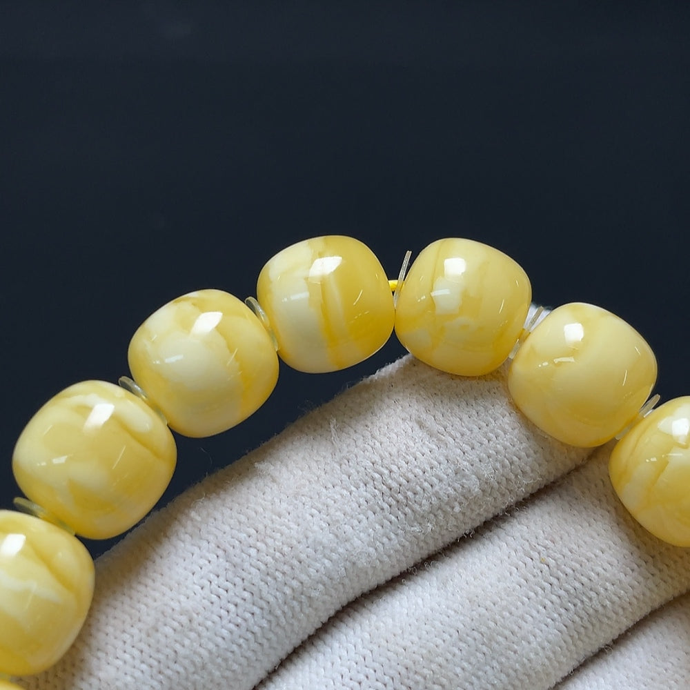 Amber beeswax bracelet from HKHQ featuring natural amber beads and a lightweight, stylish design.