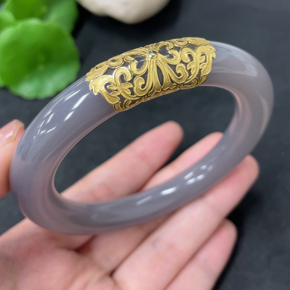 HKHQ Hetian jade round bangle with 18k gold accents, size 60.3, weighing approximately 73.5g, showcasing smooth, polished surface.