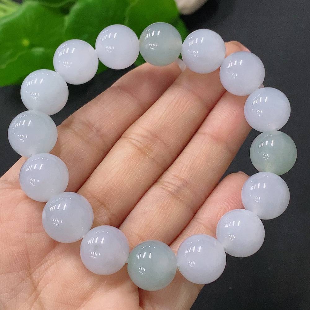 Huiliu Jadeite bracelet featuring 12.3mm smooth, polished jade beads, certified by HUILIU HQ for quality and authenticity.