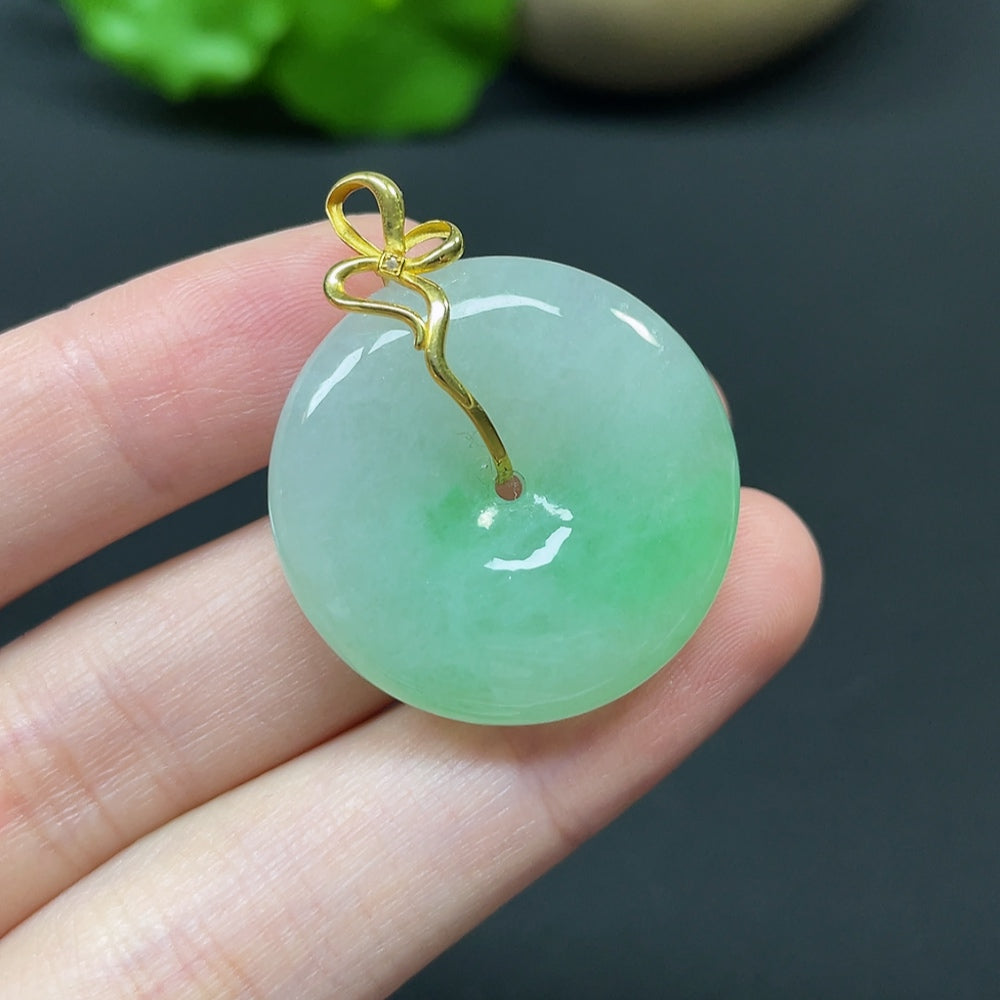 Jadeite Peace Knot pendant with 18k gold, diamond side stones, featuring intricate inlaid jade design from HKHQ.