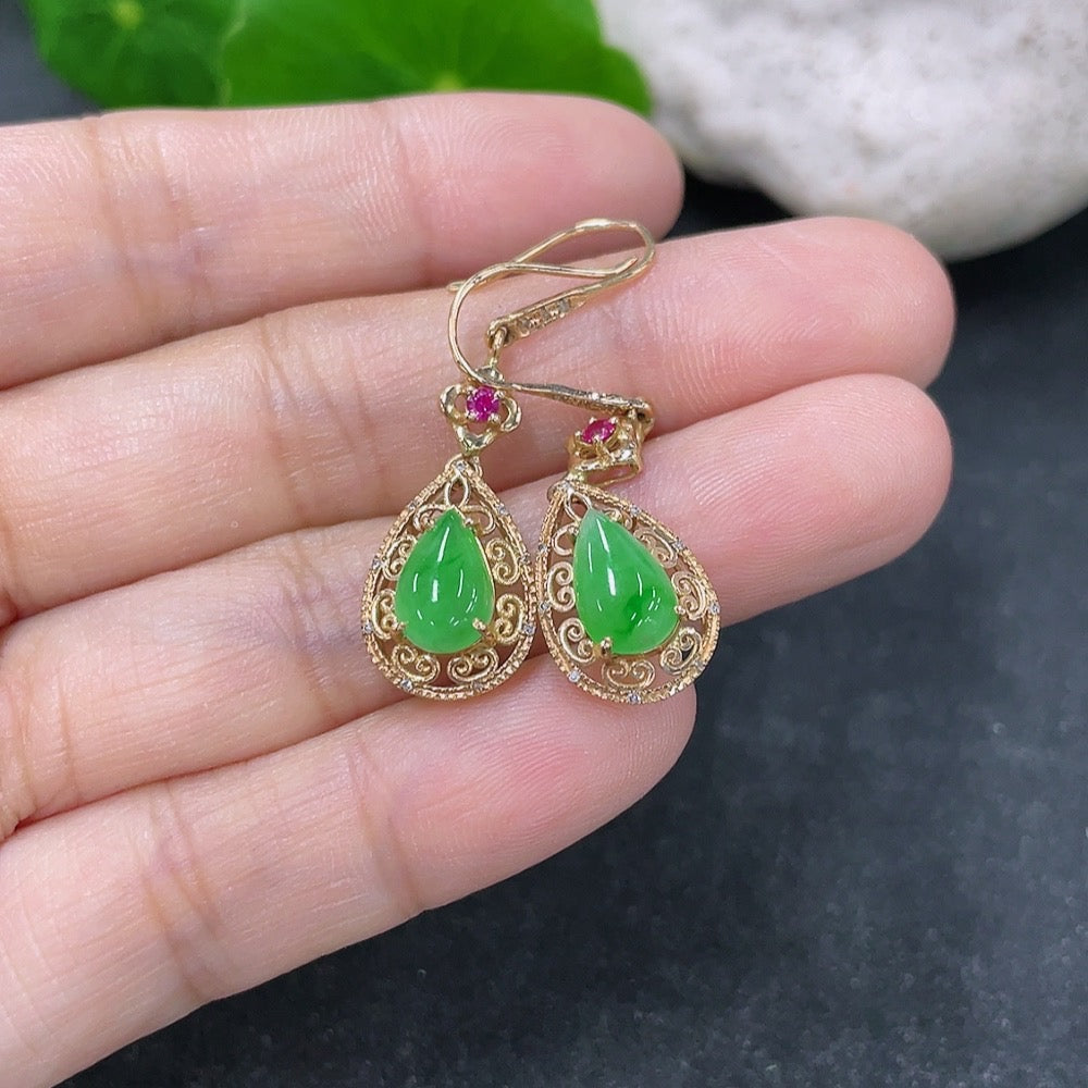 Jadeite drop earrings with 18k gold setting and diamond accents, showcasing elegant gemstone and precious metal design.