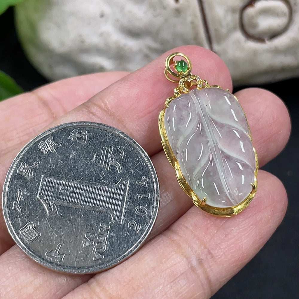 Jadeite leaf pendant with 18k gold inlay and diamond accents, weighing approximately 2.17 grams, crafted by HKHQ.