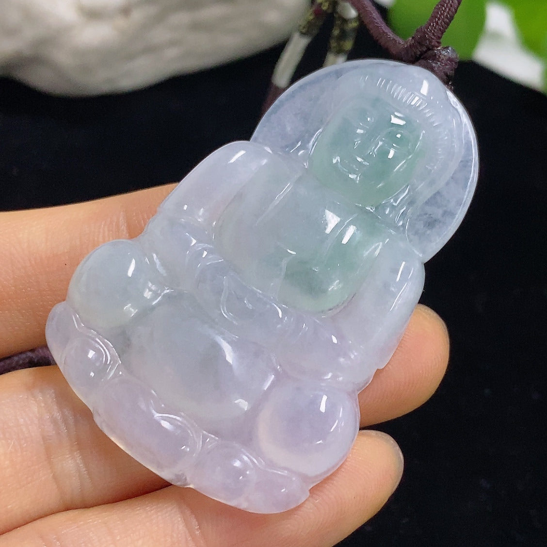 Jadeite Guanyin pendant with intricate carving, weighs approx. 21.6g including rope, crafted by HKHQ, showcases detailed jade craftsmanship.