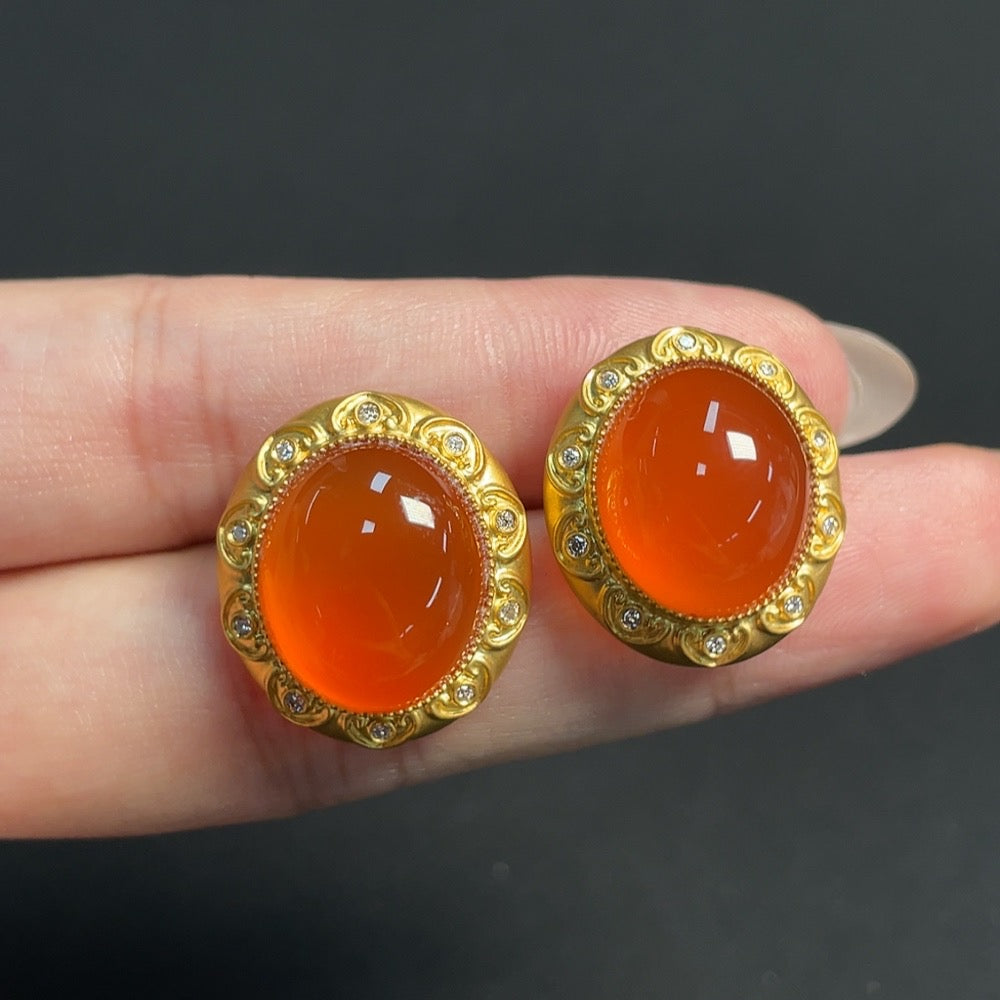 South red agate gemstone earrings with 18K gold, diamond accents, non-gold ear stoppers, featuring organic material details.