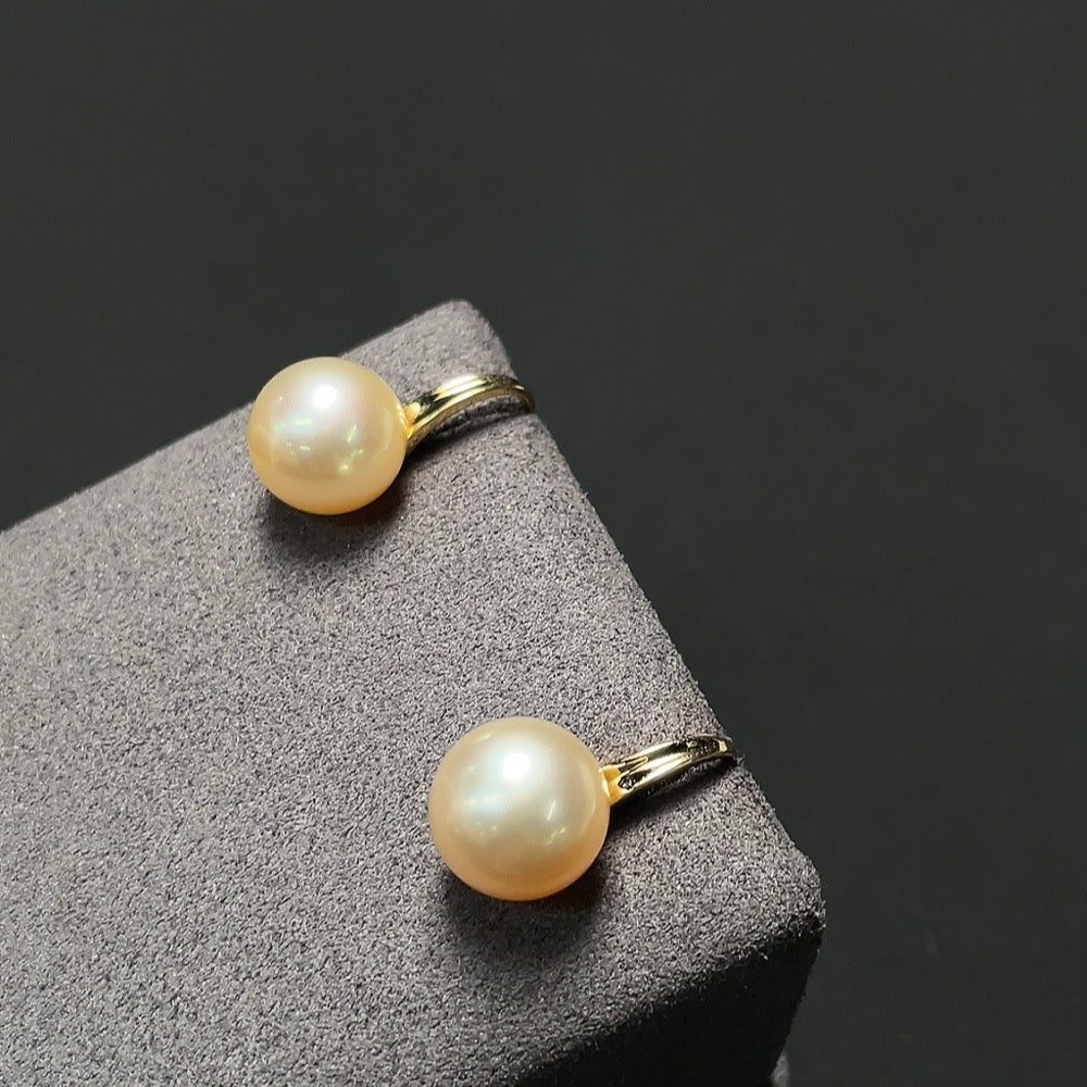 Saltwater pearl earrings with 18K gold hooks from HKHQ, featuring lustrous white pearls and elegant design.