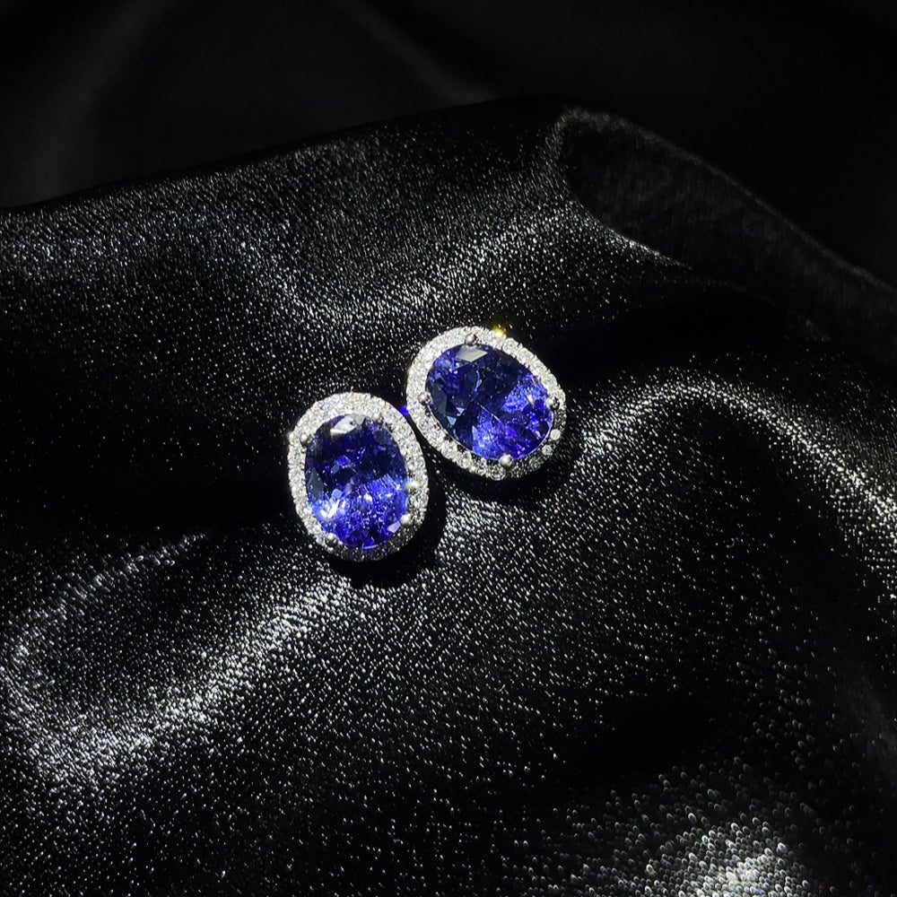 18K Tanzanite earrings featuring vibrant gemstone drops with a total weight of approximately 2.25 grams, by HKHQ.