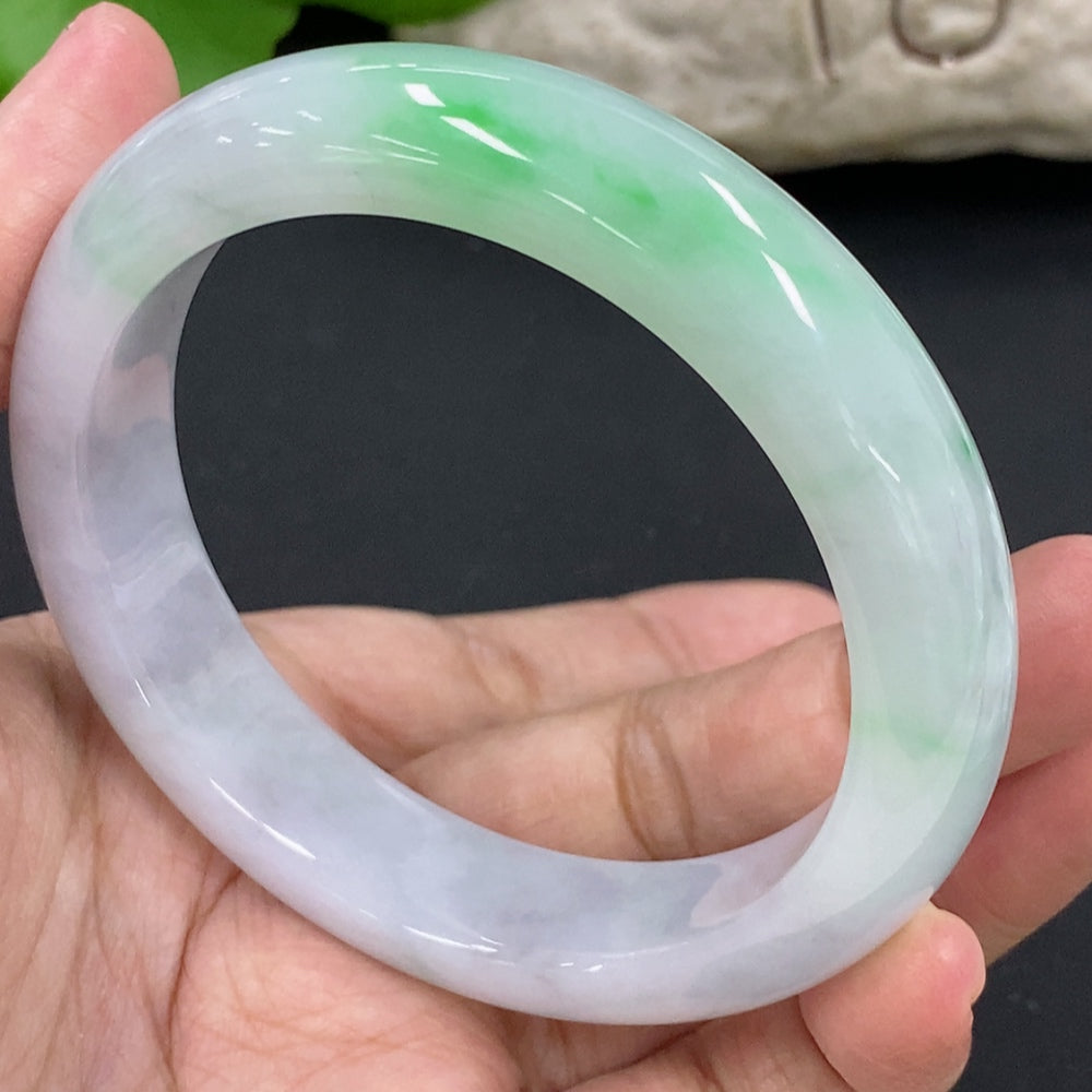 HKHQ jadeite round bangle bracelet, size 57.1, weighing 64.6g, showcasing smooth, polished jadeite in a circular design.