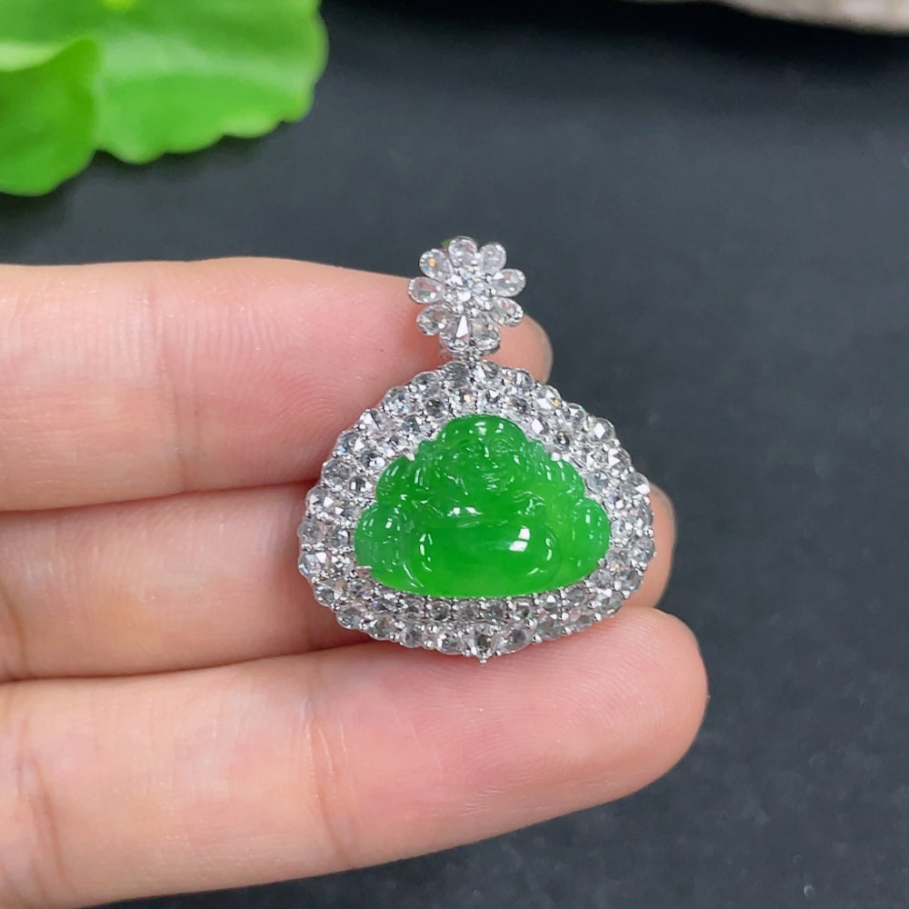 Jadeite pendant with 18k gold and diamond accents, weighing approximately 7.3g, featuring a polished jade gemstone and intricate design.