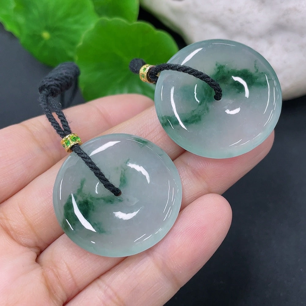 Jadeite pendant with peace buckle design, suspected gold-plated, from HKHQ, featuring a smooth green jade surface and intricate details.