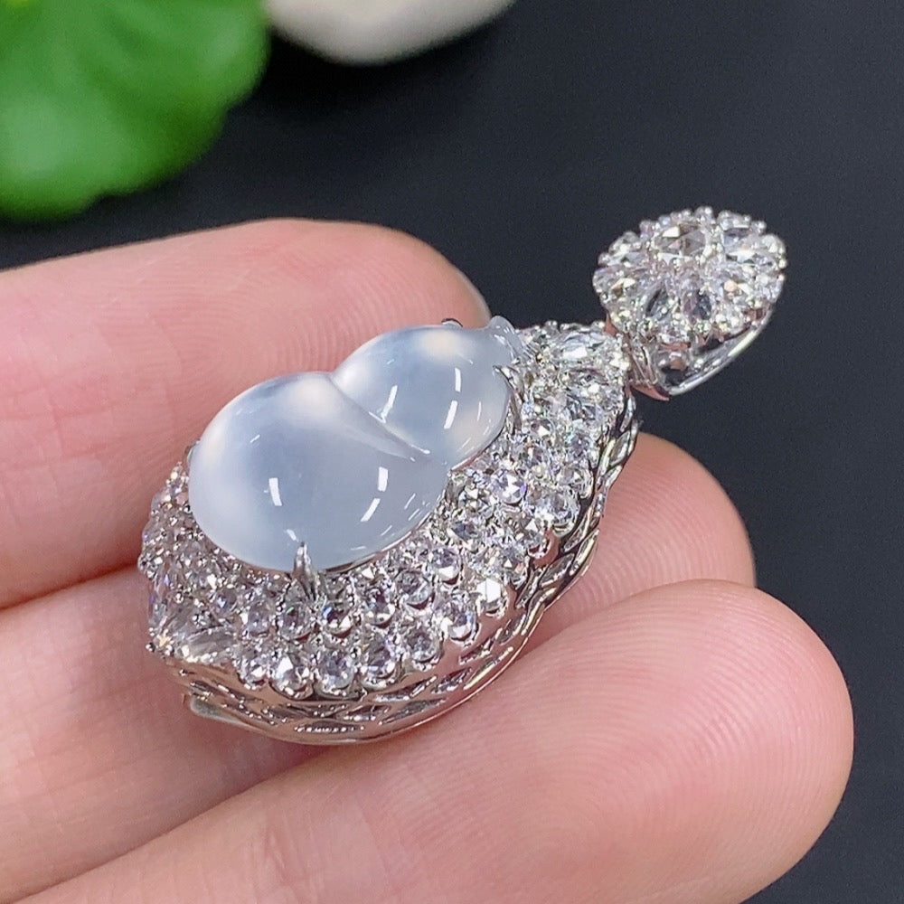 Jadeite gourd pendant with diamond accents in 18k gold, displayed on a necklace chain, weighing approximately 7.2 grams.