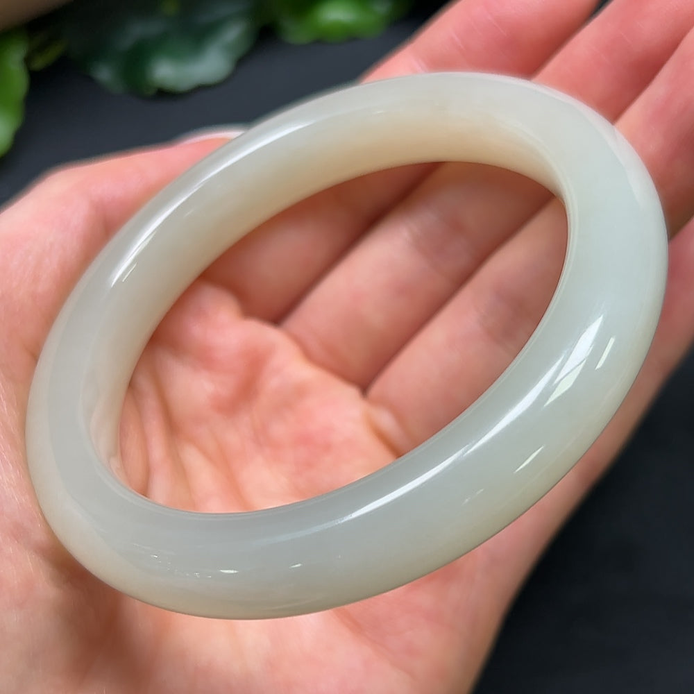 Hetian Jade round bracelet by HKHQ, 58.9mm size, weighing approximately 56.79g, showcasing smooth, polished jade beads.