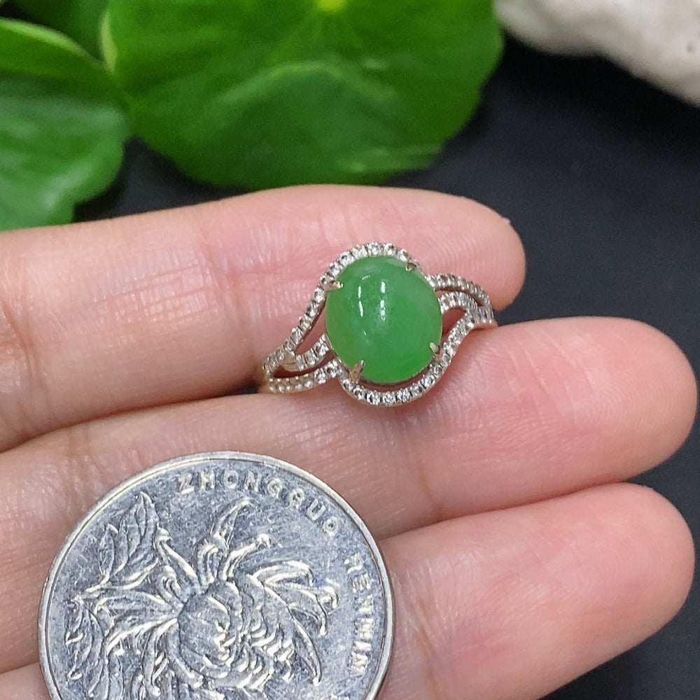 Jadeite cabochon ring with diamond accents in 18K gold, size 15, featuring a polished green jade gemstone and gold band.