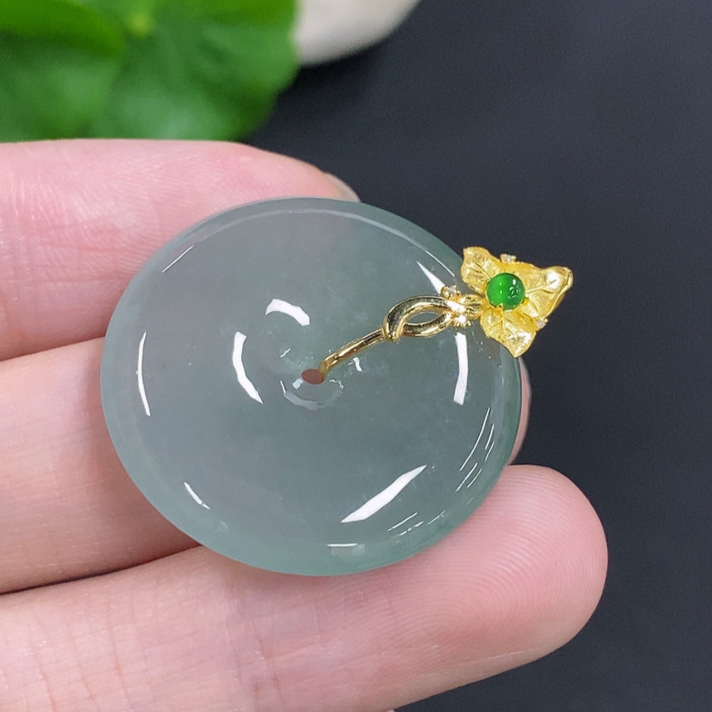 Jadeite Peace Knot pendant by HKHQ in 18K gold, weighing approximately 8.8g, featuring a smooth, polished jade design.